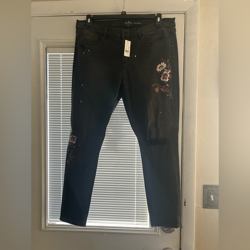 Faded black destructed jeans with flowers